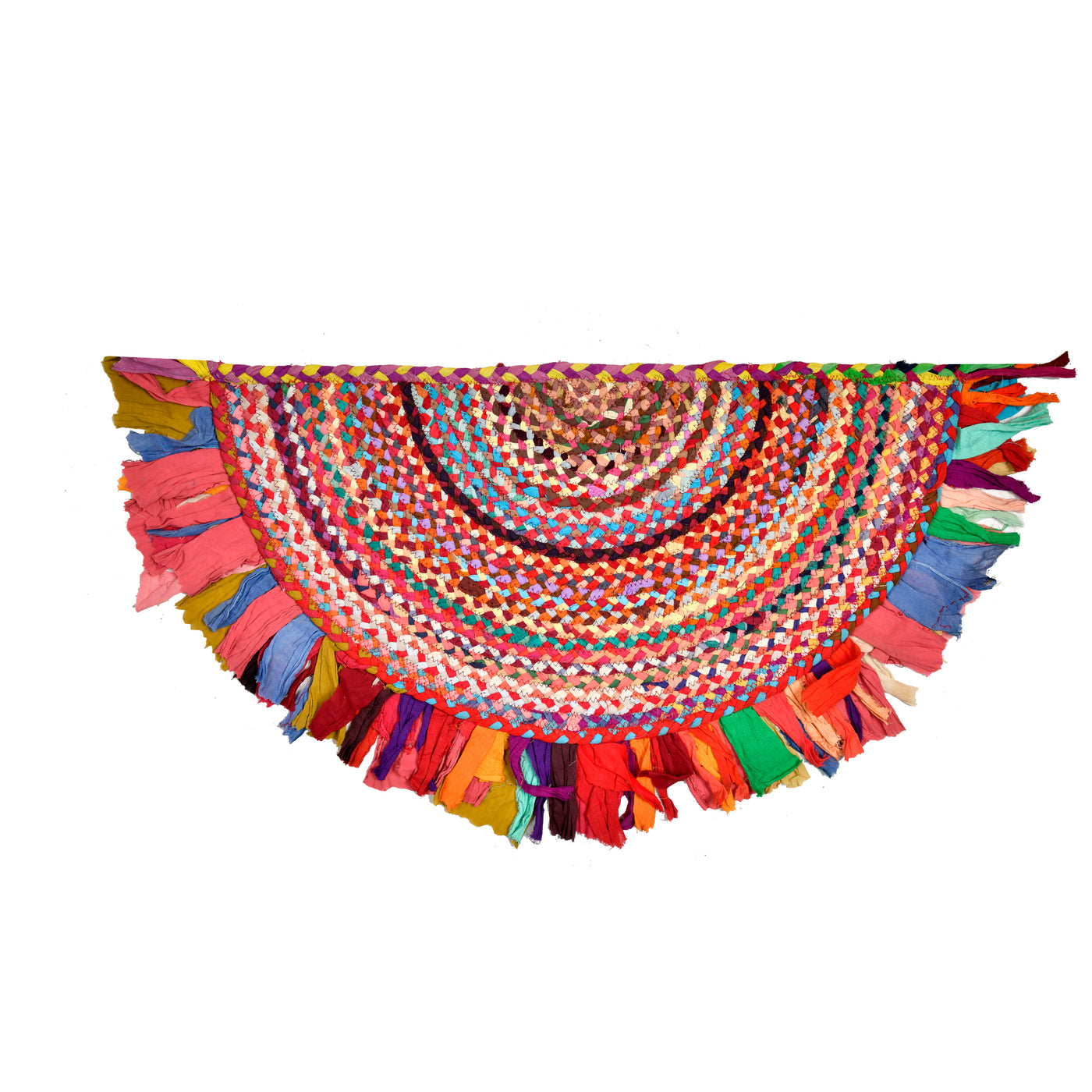 A vibrant, handwoven circular rug made from colorful fabric strips, featuring a dense braided center and long, fringed edges in a variety of bright colors, shown against a plain white background.